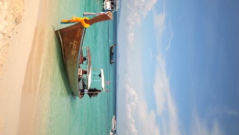 boat-in-the-Beach-of-Bamboo-islands,-Thailand,-Vertical-video