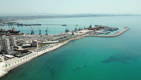 Durres,-city-buildings-and-port-by-the-Adriatic-Sea,-aerial-view-from-a-drone