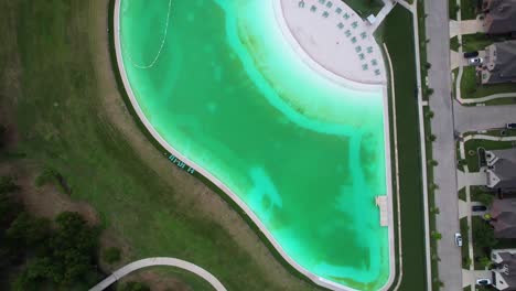 Aerial-footage-of-the-Crystal-Lagoon-in-Windsong-Ranch-in-Prosper-Texas