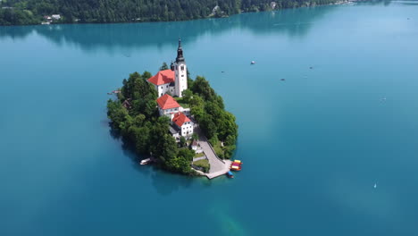 Aerial-View:-Adventure-to-the-Island-in-the-Middle-of-Lake-Bled,-Slovenia