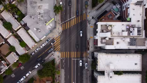 Cars-driving-at-junction-with-crosswalks-in-America