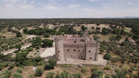 Aerial-view-circling-the-castle-of-Arguijuelas-de-Abajo-military-stronghold-in-the-city-of-Cáceres,-Spain