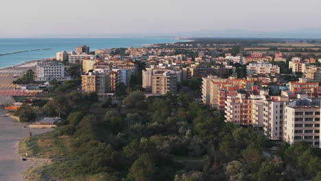 Aerial-shot-at-24-fps-of-Lido-Adriano-town-and-its-building,-typical-adriatic-shore
