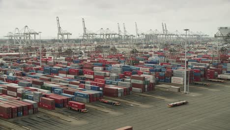 Panorama-Rotterdam-cargo-harbour,-container-storage-system,-cranes-operating