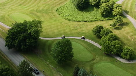 Overhead-aerial-shot-of-golf-cart-driving-to-different-spot-in-golf-course