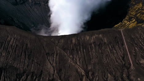 Aerial-hyperlapse-shot-of-the-smoking-Bromo-volcano-crater,-in-Java,-Indonesia