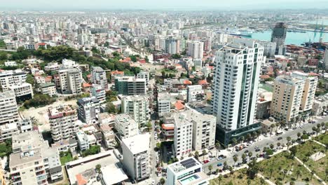 Durres,-tall-city-buildings-along-the-Adriatic-Sea-coast,-aerial-view-from-a-drone