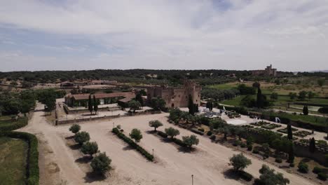 Aerial-view-circling-the-castle-of-Arguijuelas-de-Abajo-scenic-grounds-and-courtyard-in-the-city-of-Cáceres