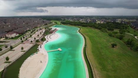 Aerial-footage-of-the-Crystal-Lagoon-in-Windsong-Ranch-in-Prosper-Texas