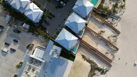 Aerial-top-down-descending-shot-of-luxurious-condominium-located-on-Orange-Beach-in-Gulf-Shores-Alabama