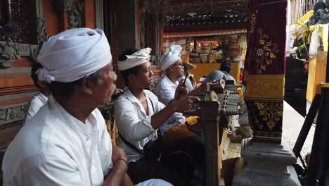Balinese-Local-People-Play-Gamelan-Music-at-Hindu-Ceremony-Religious-Offering,-Bali-Indonesia,-Culture-of-Southeast-Asia,-Hinduism