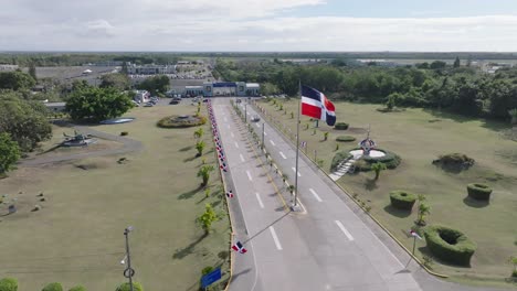Entrance-to-military-airbase-in-San-Isidro,-waving-dominican-republic-flag