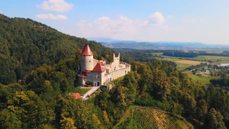 Stunning-4K-drone-footage-of-a-castle-Žovnek-located-northeast-pf-Braslovče,-Slovenia