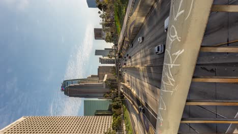 Vertical-View-Of-Vehicles-Driving-On-Route-110-From-The-4th-Street-Bridge-In-Downtown-Los-Angeles,-California