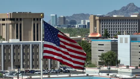 American-flag-waving-in-front-of-Phoenix,-Arizona-capitol-building
