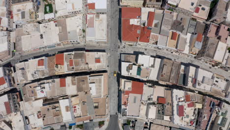 Top-down-drone-shot-of-Miaouli-square-and-city-hall-building-in-Ermoupoli-city-of-Syros-island,-Greece-during-morning-hours