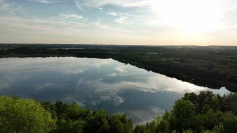 Aeria-view-of-Osadnik-Gajówka-artificial-lake-in-Gmina-Przykona,-within-Turek-County,-Voivodeship,-Poland