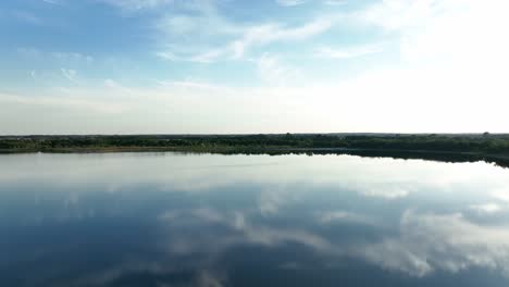 aerial-panoramic-view-of-Osadnik-Gajówka-artificial-lake-in-Gmina-Przykona,-within-Turek-County,-Greater-Poland-Voivodeship,-Poland