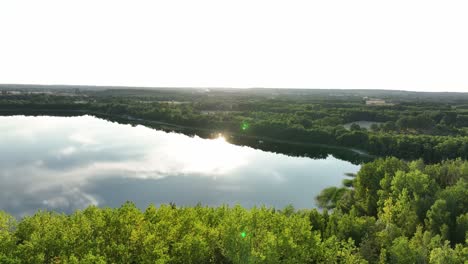 Aeria-view-of-Osadnik-Gajówka-artificial-lake-in-Gmina-Przykona,-within-Turek-County,-Greater-Poland-Voivodeship,-Poland