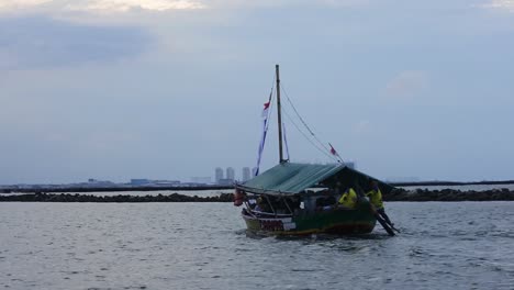 Traditional-tour-boats-in-Ancol-beach,-North-Jakarta,-Indonesia--HD-video