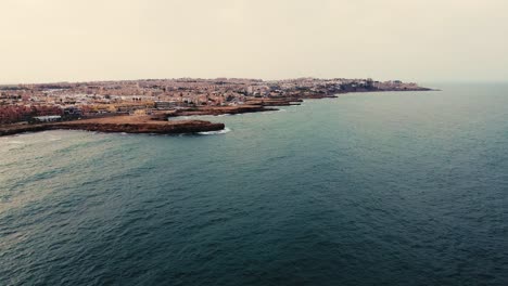 Aerial-drone-view-of-cityscape-and-coastline-of-Torrevieja-beach-in-Spain