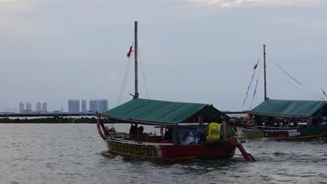 Tour-boats-cruise-in-the-waters-of-Ancol,-North-Jakarta,-Indonesia