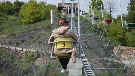 Female-Tourist-Riding-A-Chairlift-At-Prague-Zoological-Garden-In-The-Czech-Republic