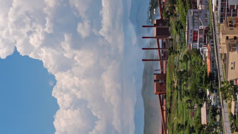 Cloudscape-time-lapse-over-the-nickel-extraction-factory-in-Noumea,-New-Caledonia---vertical-orientation