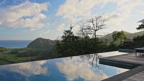 Luxury-architecturally-designed-infinity-pool-on-the-edge-of-wooden-balcony-in-Lombok,-Indonesia