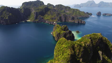 Cinematic-aerial-footage-of-a-beaches-and-cliffs-of-Palawan-at-bright-daylight-in-the-Philippines,-Asia,-Drone
