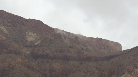 Teide-national-park,-grey-clouds-timelapse-dancing-over-mountain-top