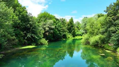Pristine-Turquoise-Blue-Lake-Landscape-around-Green-Forest-in-Ljubljana-Slovenia-Slow-Motion-Travel-and-Tourism-Destination