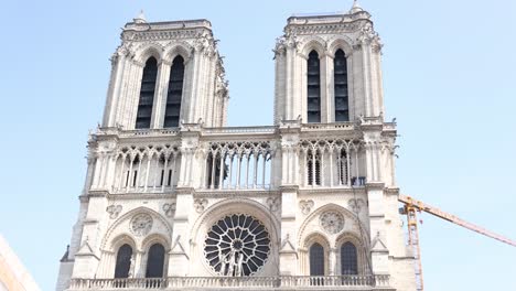 Notre-Dame-Medieval-Cathedral-Building-in-Paris,-France---Popular-Tourist-Attraction,-Tilt-up-Reveal