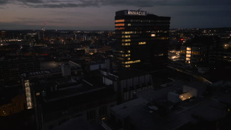 Establishing-Drone-Shot-of-Pinnacle-Building-and-Leeds-City-Centre-at-Night
