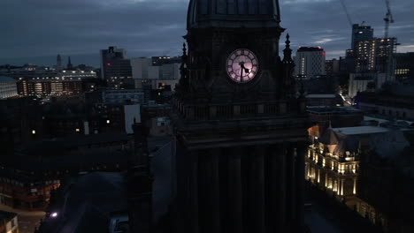 Rotating-Drone-Shot-Around-Leeds-Town-Hall-Clock-Tower-with-Leeds-City-Centre-in-Background-at-Blue-Hour-Low-Light