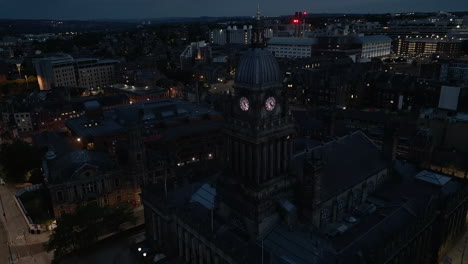 Descending-Establishing-Drone-Shot-of-Leeds-Town-Hall-and-City-Centre-at-Night-in-Low-Light