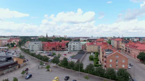 Aerial-rise-revealing-city-Eskilstuna-in-Sweden,-Europe-on-beautiful-day