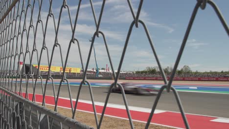 Formula-1-F1-race-cars-speeding-around-a-turn-at-Circuit-of-the-Americas-during-a-test-lap