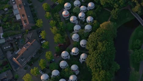 Flying-over-the-Bolwoningen,-also-known-as-Dome-Houses-at-'s-Hertogenbosch,-aerial