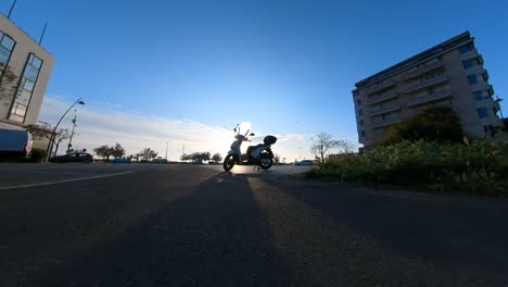 Slow-Motion-Footage-Of-Motion-Toward-A-Scooter-Standing-In-A-Parking-Lot-In-Italy