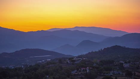 Colorful-Orange-sunset-time-lapse-overlooking-the-hills-at-Mount-Olympos-in-Cypress