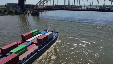 Ships-cross-dozens-of-containers-in-the-city-of-Dordrecht,-South-Holland,-Netherlands