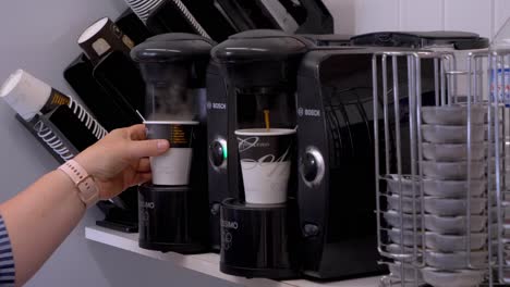 Coffee-machines-making-coffee-in-paper-cups-at-a-campsite