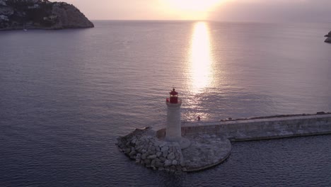 Far-de-Port-d'Andratx-at-Mallorca-during-sunset-with-calm-sea,-aerial