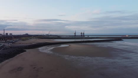 Cinematic-Aerial-at-Sunrise-of-Port-Talbot-Beach-with-Steelworks