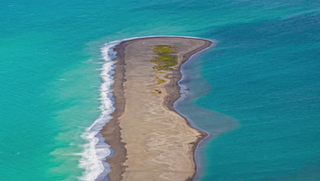 Aerial-Timelapse-of-sandbar-panhandle-island-surrounded-by-turquoise-water-with-waves-crashing