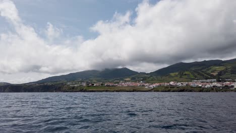 The-coastline-of-Villa-Franca,-San-Miguel-Island,-Azores,-Portugal---filmed-from-a-boat