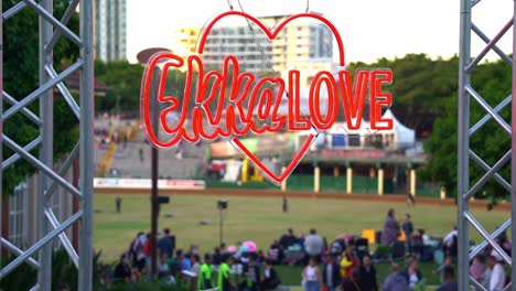 Close-up-shot-of-retro-Ekka-love-sign-at-the-popular-annual-event,-Ekka-Royal-Queensland-Show,-Brisbane-RNA-Showgrounds-at-Bowen-Hills,-crowds-at-the-background