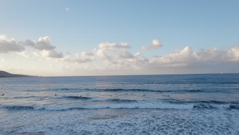 Las-Canteras-Beach-,-Surfer-riding-waves,-Canary-Island,-Spain,-Drone-shot