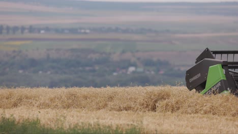 Large-harvest-combine-driving-over-a-grain-field-in-Romania